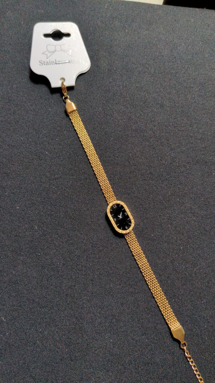 gold-tone Xavier Masterpiece ladies' watch with a black dial and mesh band.