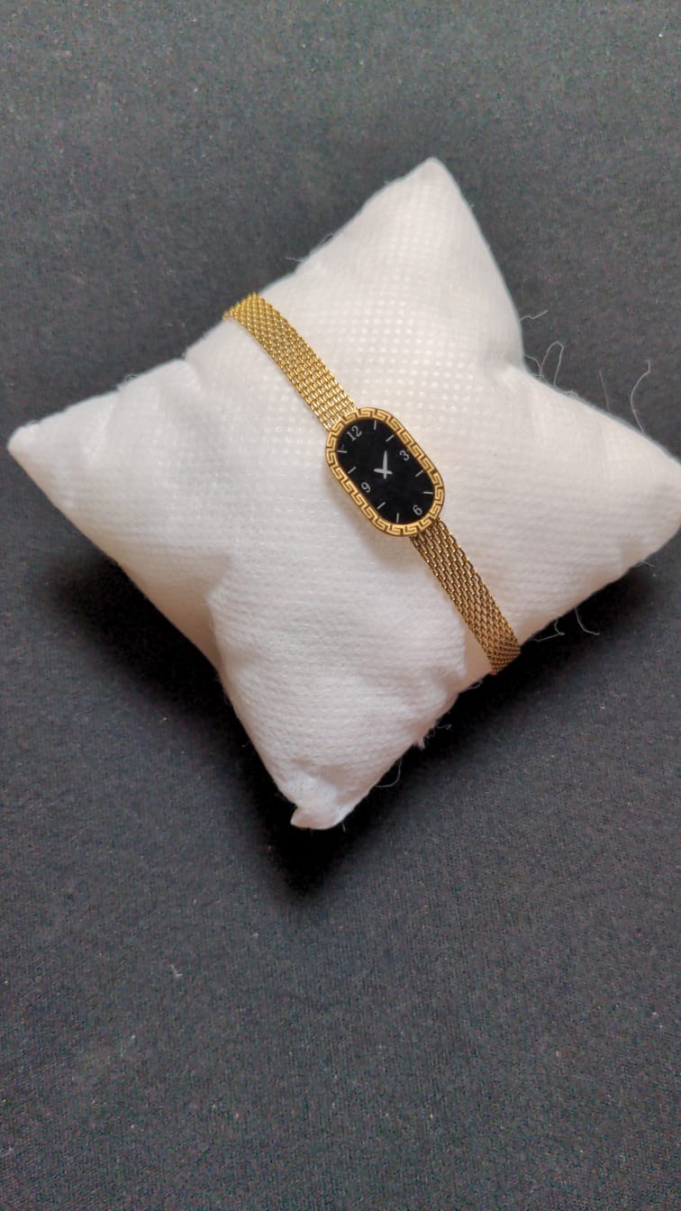 gold-tone Xavier Masterpiece ladies' watch with a black dial and mesh band.